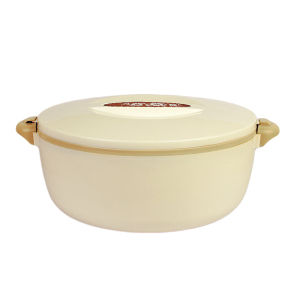 A beige, oval-shaped, stainless steel food warmer with a lid and beige handles.