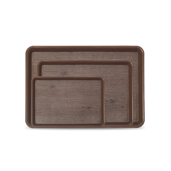 Set of three brown serving trays of different sizes on a white background