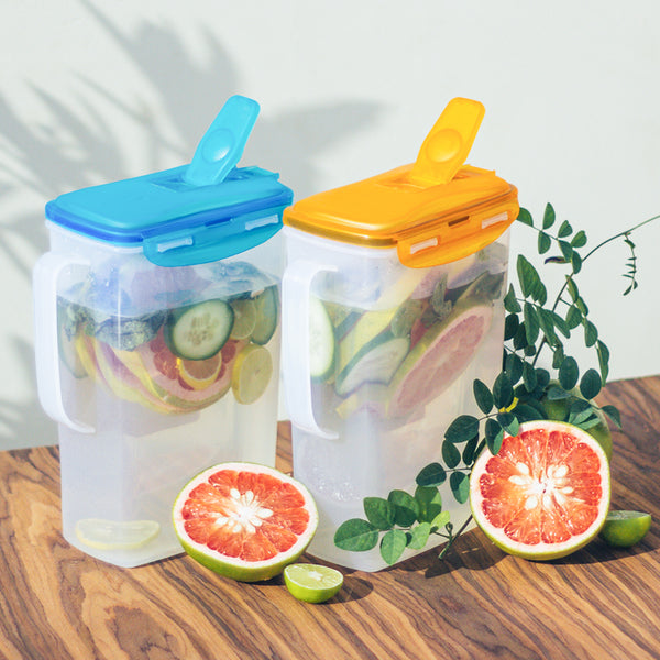 Two containers with colorful lids filled with sliced fruits on a wooden surface.