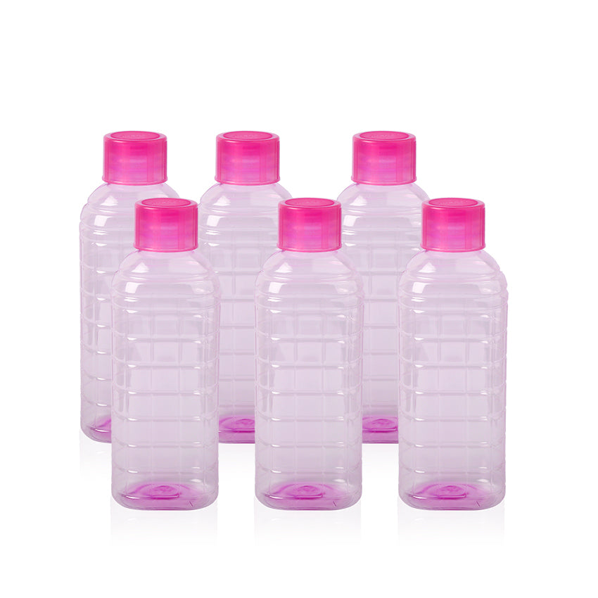 Set of six clear plastic bottles with pink caps on a white background